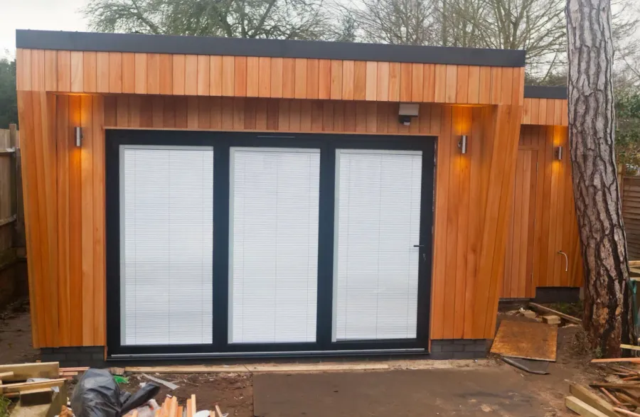 Prefab garden suite modules being assembled on a prepared foundation in a GTA backyard