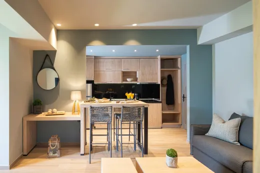 Bright open-concept garden suite interior with living and kitchen areas
